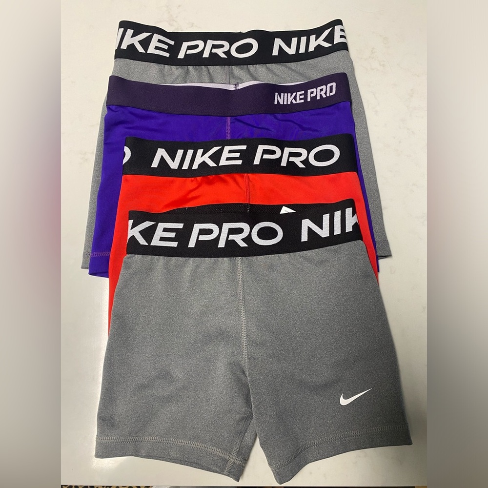 Four pairs of Nike pro girls shorts bundle